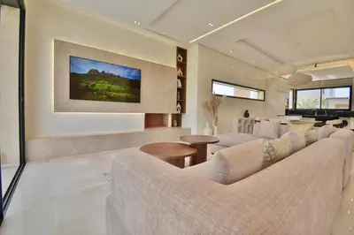 a living room with a couch and a table at Villa Luxe 5 Suites & Piscine in Marrakech
