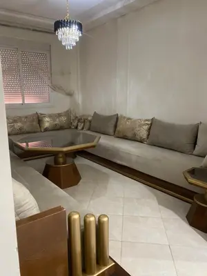 a living room with a couch and a table at Marrakech Bassatine targa in Marrakech