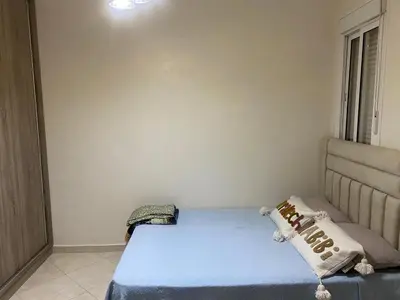 a small bedroom with a bed and a window at Marrakech Bassatine targa in Marrakech