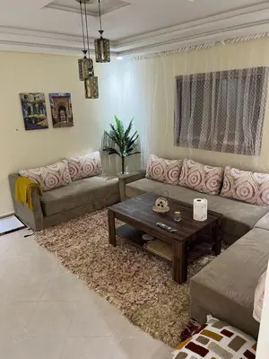 a living room with a couch and a coffee table at Nice apartment in Marrakech