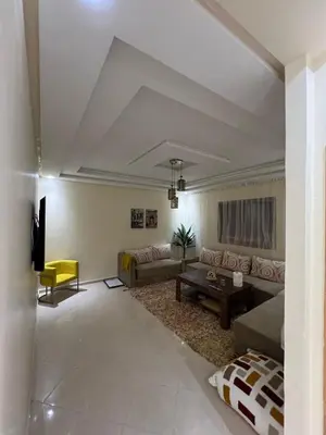 a living room with a couch and a table at Nice apartment in Marrakech