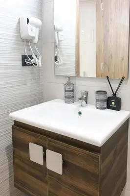 a bathroom with a sink and a mirror at Signature Suite Private Pool in Marrakech