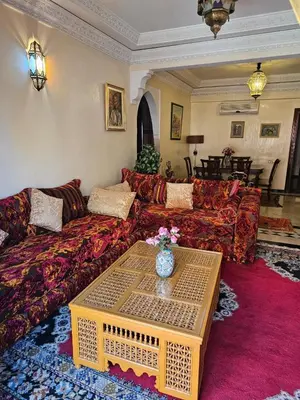 a living room with a couch and a table at Warda-A-31 Rue Abi Hanifa in Marrakech