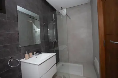 a bathroom with a white sink and a shower at Smart Loft in Marrakech
