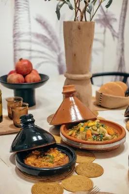 a table with plates of food on a table at Dar Baraï in Marrakech