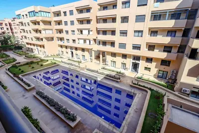 an overhead view of an apartment building with a swimming pool at Piscine- Résidence haut de Gamme in Marrakech