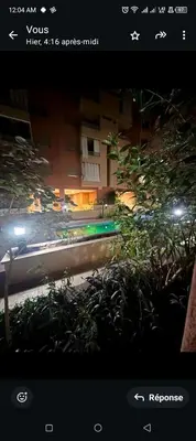 a view of a city street at night at Spacieux appartement familial 2 in Marrakech