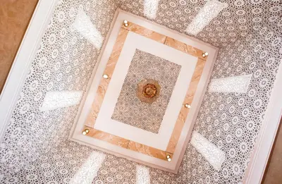 a picture frame on the floor of a room at Riad Dar Mima Hnina - Your Traditional and Private haven of peace, 2 pools, 10' from airport in Marrakech
