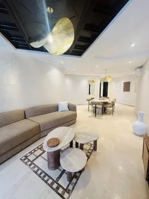 a living room with a couch and a table at Sublime 2 bedrooms with pool and Wi-Fi Marrakech in Marrakech