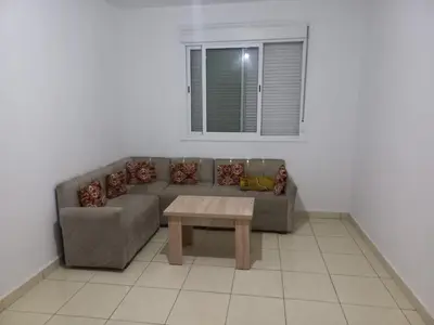 a living room with a couch and a table at Appartement au centre de marrakech in Marrakech