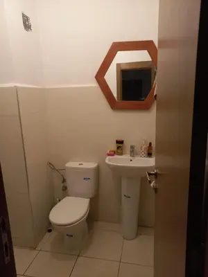a bathroom with a toilet and a sink at Appartement au centre de marrakech in Marrakech