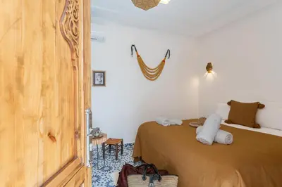 a bedroom with a bed in a room at Riad OM SAADENE in Marrakech