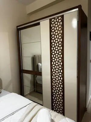 a mirror in a room with a bed and a bed sqor at Modern Apartment Near Airport in Marrakech