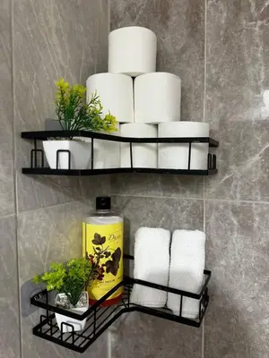 a bathroom with a shelf with towels and toilet paper at Modern Apartment Near Airport in Marrakech