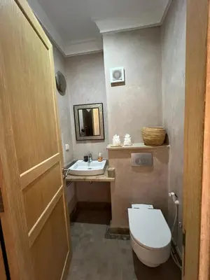 a bathroom with a toilet and a sink at Resort Apartment Golf View in Marrakech