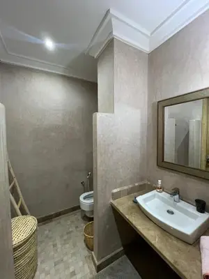 a bathroom with a sink and a toilet at Resort Apartment Golf View in Marrakech