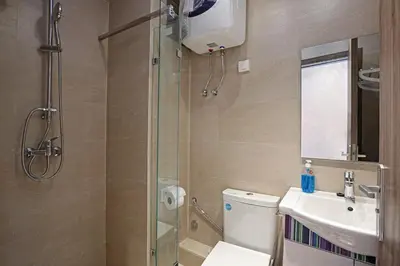 a bathroom with a shower and a toilet and a sink at New Elegant and cozy appartement next to carre eden in Marrakech
