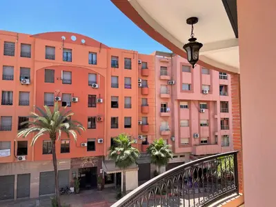 a view of a building from a balcony at Apartement de Luxe mit Tiefgarage in Marrakech