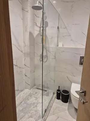 a bathroom with a shower and a toilet at Elegant & Comfortable Apartment in Marrakesh in Marrakech