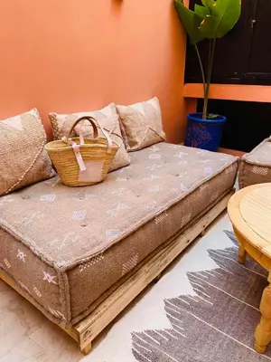 a bed with a basket on top of it at Appartement luxueux Gueliz in Marrakech