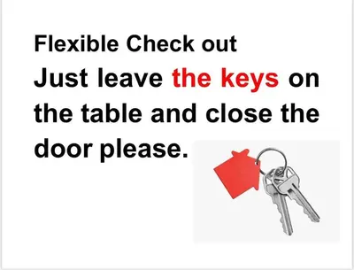a pair of keys on a white background at Julie Airport Boarding Apartment in Marrakech
