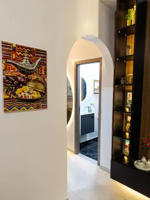 a hallway with a mirror and a painting on the wall at Cozy Apt Close to Gueliz Medina in Marrakech