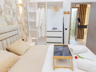 a room with a bed with a table in it at Cozy Apt Close to Gueliz Medina in Marrakech