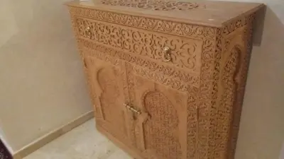 a wooden cabinet with intricate designs on it at Palace-Apartment-Marrakech in Marrakech