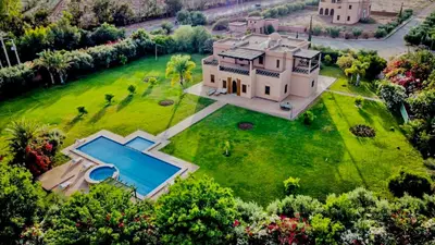 an aerial view of a large estate with a swimming pool at Villa Dar zitoune in Marrakech