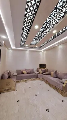 a living room with a large couch in a room at MELBARI Central-Appart in Marrakech