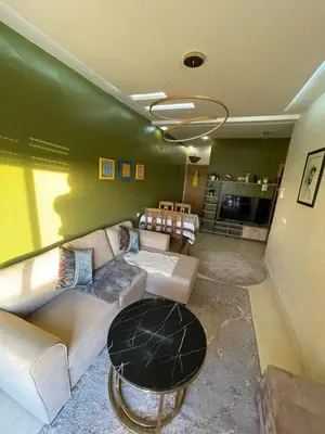 a living room with a couch and a table at Sultana in Marrakech