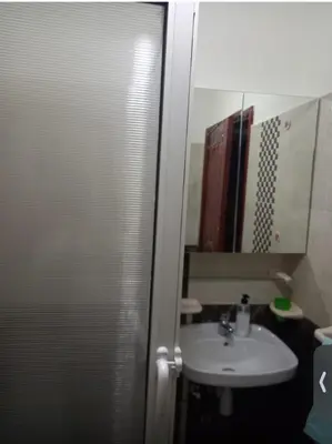 a bathroom with a sink and a mirror at Modern 2bedroom full furnished in downtown in Marrakech