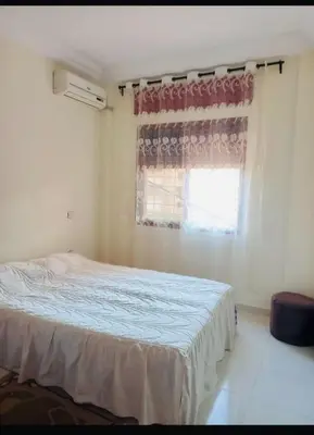 a bedroom with a bed in front of a window at Modern 2bedroom full furnished in downtown in Marrakech