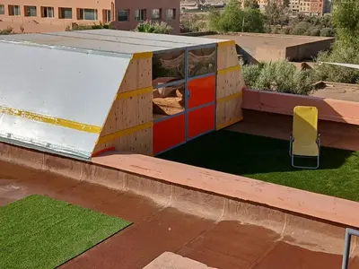 a building with colorful doors on a roof at Chateau Nougat, Marrakech in Marrakech