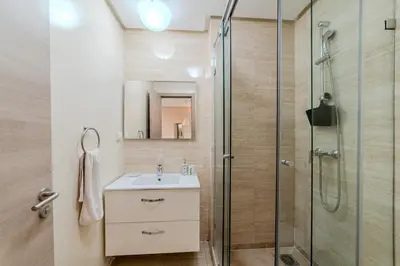 a bathroom with a sink and a shower at Elegant Appartement Piscine Golf et Wifi in Marrakech