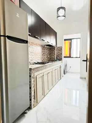 a kitchen with a stainless steel refrigerator at marrakech geliz in Marrakech