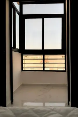 a large window in a room with a bed at marrakech geliz in Marrakech