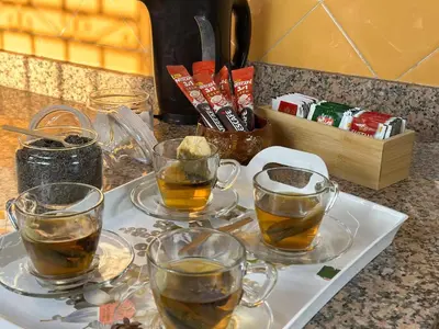 a tray with four cups of tea on a counter at Charmant & chic à Gueliz in Marrakech
