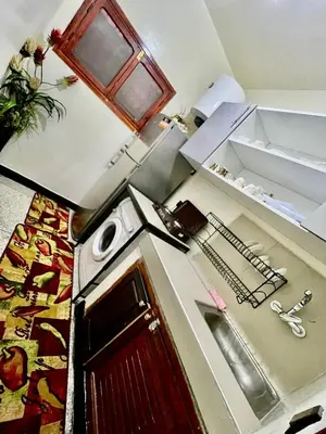 an overhead view of a kitchen with a stove and a door at Mhamid airport in Marrakech