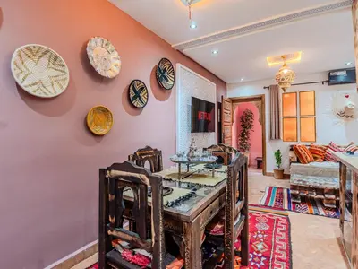 a dining room with plates on the wall at Dar LalaFadma-Pvt 1BR Studio-1min to Bahia Palace in Marrakech