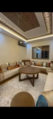 a living room with a couch and a coffee table at Appartement de rêve in Marrakech