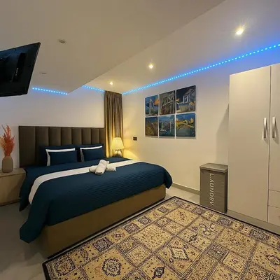 a bedroom with a bed and a television in it at Studio chic in Marrakech