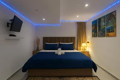 a bedroom with a bed with a teddy bear on it at Studio chic in Marrakech