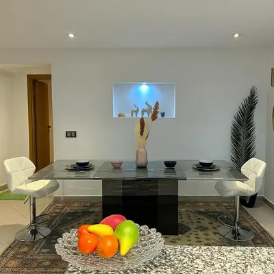 a table with a bowl of fruit in a room at Studio chic in Marrakech