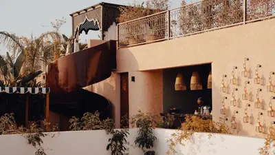 a building with a bar on the side of it at The Mellah Hotel in Marrakech