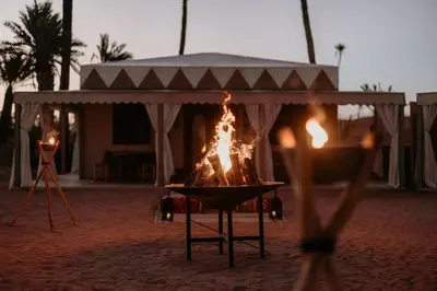 a fire pit in the middle of a field at Palmeraie Oasis Camp - A member of Barcelo Hotel Group in Marrakech