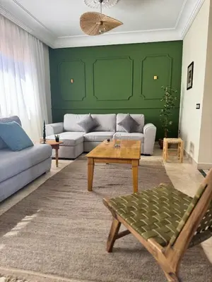 a living room with a couch and a table at Cozy flat in Marrakesh in Marrakech