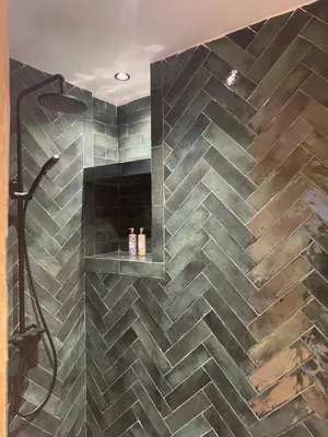a bathroom with a shower with a tiled wall at Cozy flat in Marrakesh in Marrakech