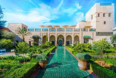 a courtyard of a building with a swimming pool at Villa Atlas Dreams in Marrakech