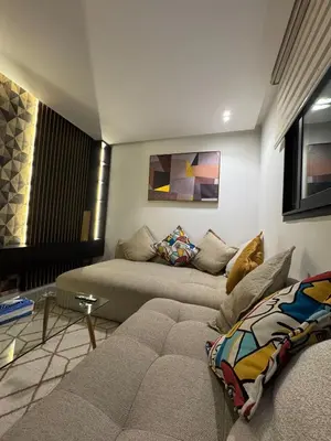 a living room with a couch and a table at Modern and Cozy Apartment Guéliz in Marrakech